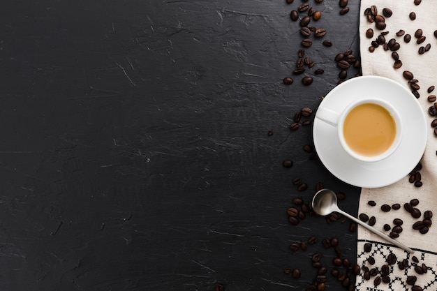 Free Photo | Flat lay of cup of coffee with spoon