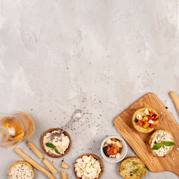 Flat lay of delicious bread with tomatoes on chopper with copy space Free Photo