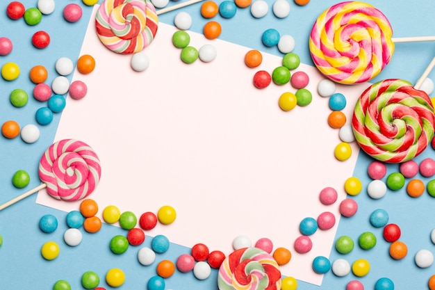 Free Photo | Flat lay of delicious colorful candies