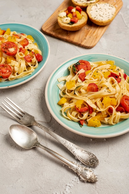 Flat lay of delicious italian food on plain background Free Photo