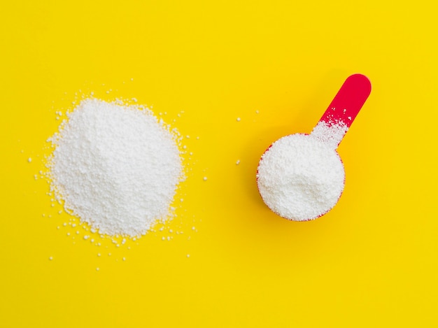 Flat-lay detergent powder on colorful background Photo | Free Download