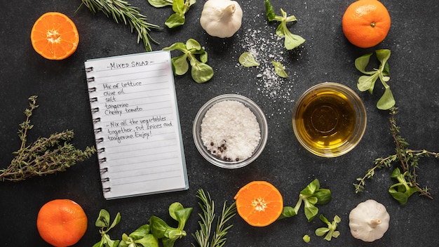 Free Photo | Flat lay of food ingredients with herbs and notebook