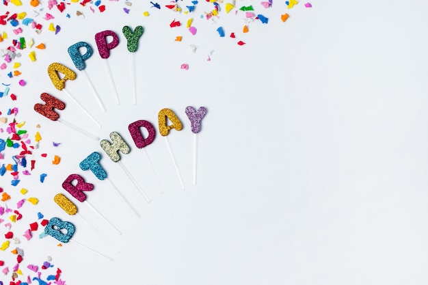 Free Photo Flat Lay Happy Birthday Lettering On White Background With Copy Space