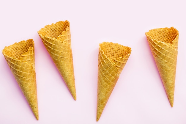 Premium Photo | Flat lay ice cream cones collection on pink background