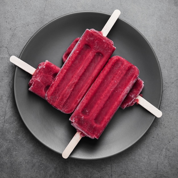 Free Photo | Flat lay ice cream on stick on plate