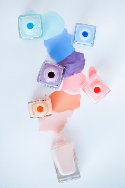 Premium Photo | Flat lay of pastel nail polish bottles