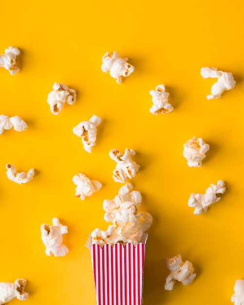 Download Free Photo Flat Lay Popcorn Bucket On Yellow Background Yellowimages Mockups