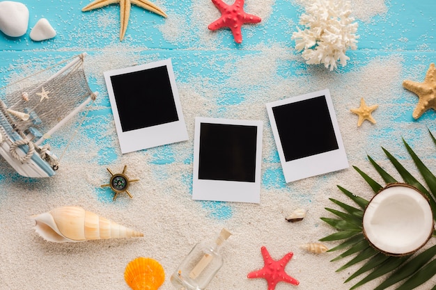 Flat lay seaside composition with polaroid pictures Free Photo