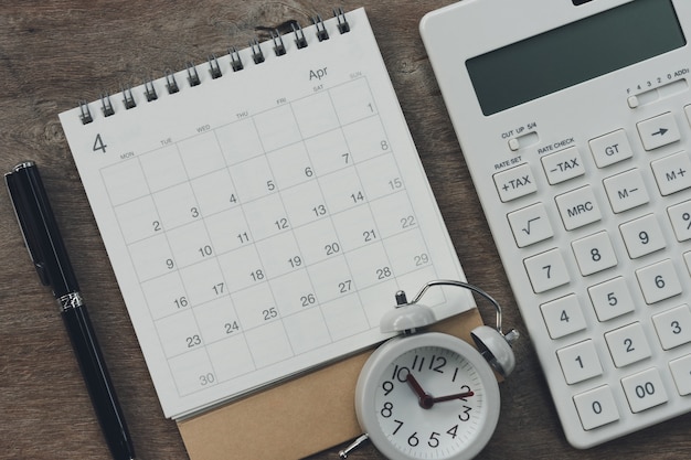 Flat Lay Of Top View Office Table Desk With Calendar Photo