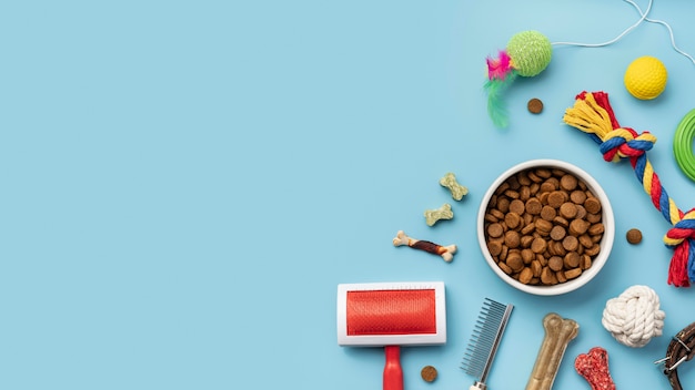 Free Photo Flat Lay Of Toys With Food Bowl And Fur Brush For Dogs