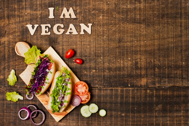Flat lay veggie hot dogs with copy-space Free Photo
