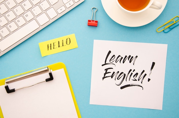 Flat lay with different objects for learning a new language Free Photo