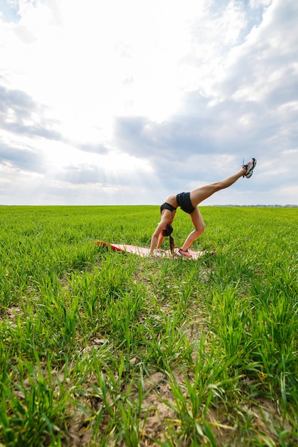 Premium Photo Flexible Girl Acrobat Gymnastic Bridge Handstand Graceful Woman In Nature 5902