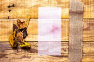 Free Photo Flimsy Paper Next To Burlap With Wooden Background