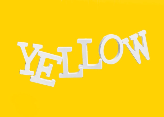 Free Photo | Floating letters forming the word yellow