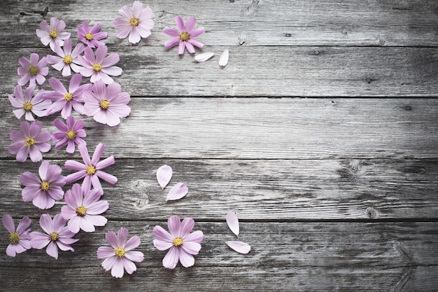 Flowers on wooden background | Premium Photo