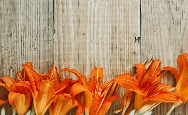 Premium Photo | Flowers on a wooden background
