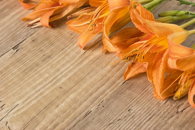 Premium Photo | Flowers on a wooden background