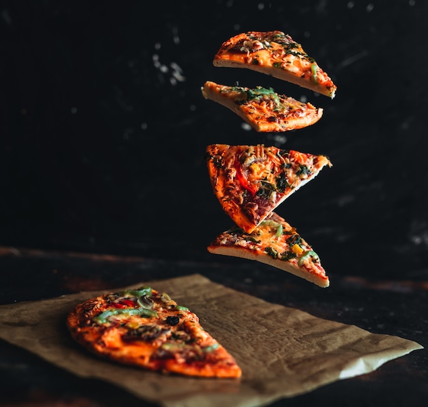 Premium Photo Flying Slices Of Pizza