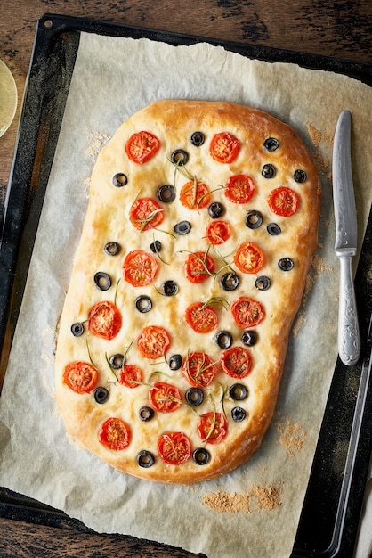 Premium Photo | Focaccia with tomatoes and olives