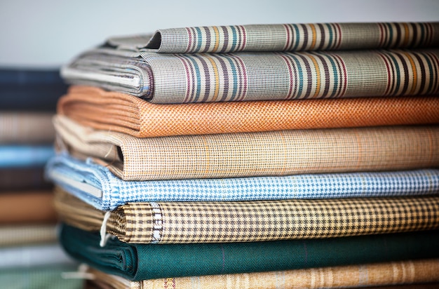 Folded fabrics in a neat stack Premium Photo