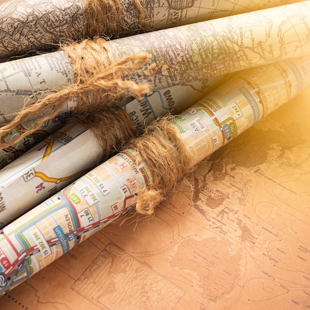 Folded maps on an old map background Photo | Free Download