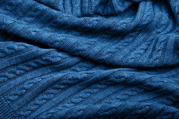Premium Photo | Folds of a knitted woolen blanket, blue color, top view ...