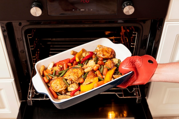 Free Photo | Food being put into oven to cook