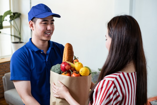 Premium Photo | Food delivery staff in blue uniform ...