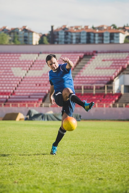 Football player shooting ball Photo | Free Download