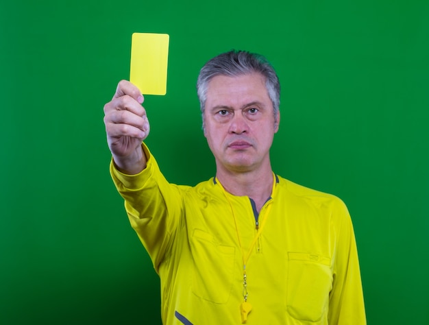 Premium Photo | Football referee on a green background