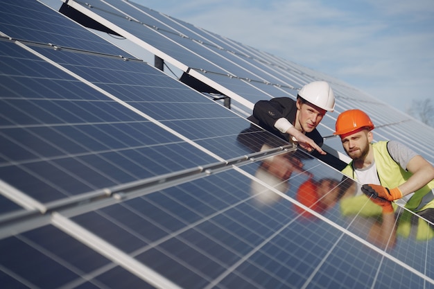 Foreman and businessman at solar energy station. Free Photo