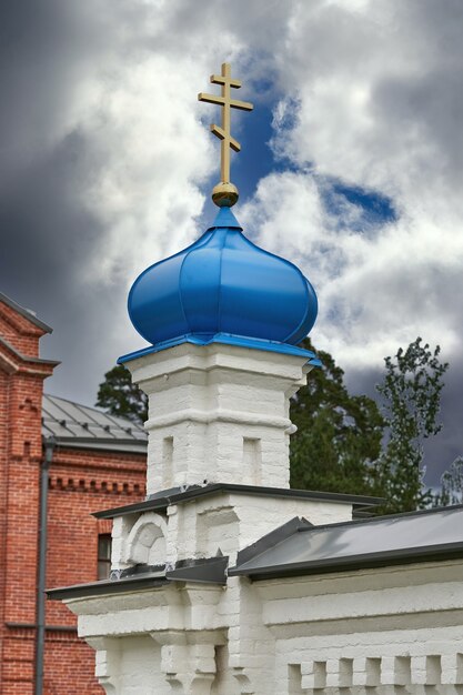 Premium Photo | Fragment of the bell tower of a christian church with a ...