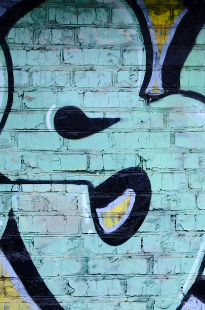 落書き図面の断片 ペイントで飾られた古い壁は ストリートアート文化のスタイルで汚れています 色付きの背景テクスチャ プレミアム写真