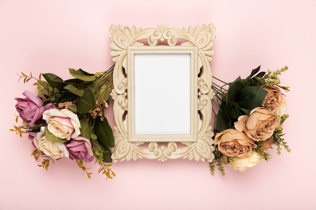 Free Photo | Frame with roses beside