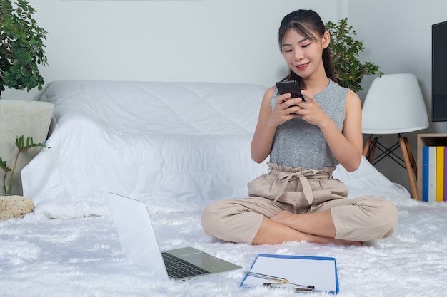 freelance-working-from-home-young-woman-is-using-phone-while-working-living-room_1150-21818.jpg (626×417)