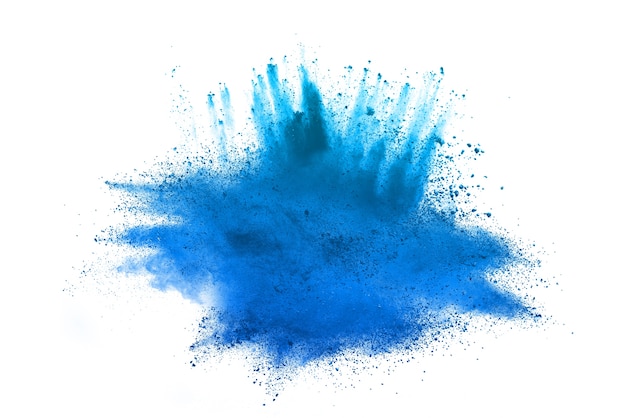 Freeze motion of blue powder exploding on white background. Photo ...