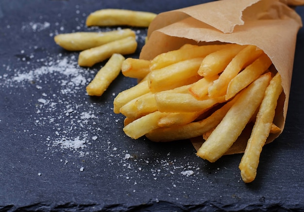 French fries in paper wrapper Premium Photo