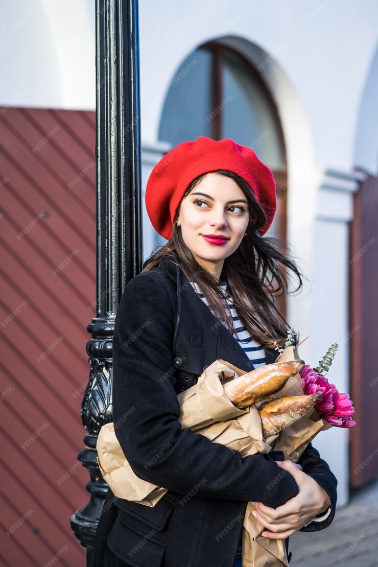 Free Photo | French woman with baguettes on the street in beret