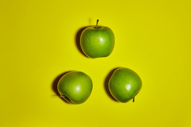 Premium Photo | Fresh apples on yellow background