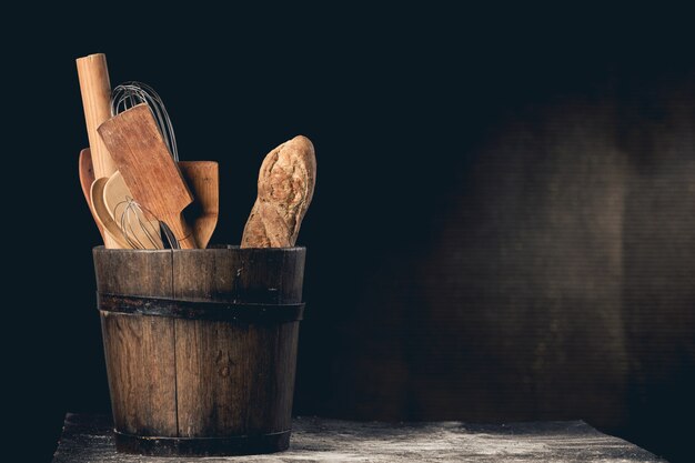 Premium Photo | Fresh baguette and kitchen utensils