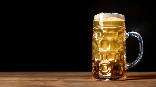 Premium Photo | Fresh beer on a table with copy space