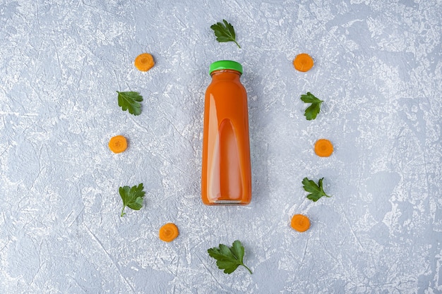 Premium Photo | Fresh carrot juice in glass bottle