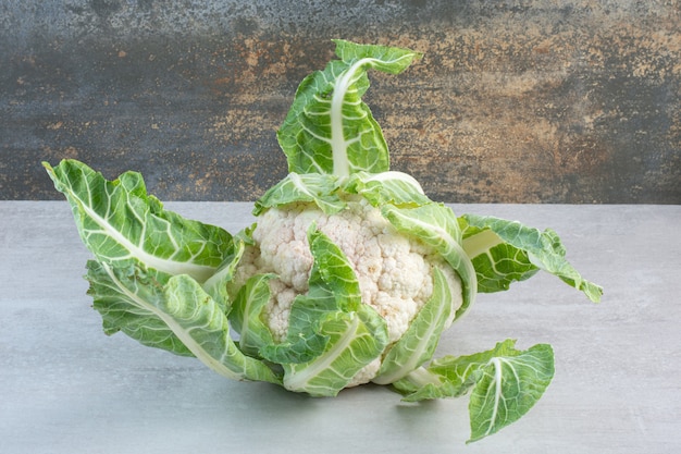 Free Photo | Fresh cauliflower with leaves on stone table. high quality ...