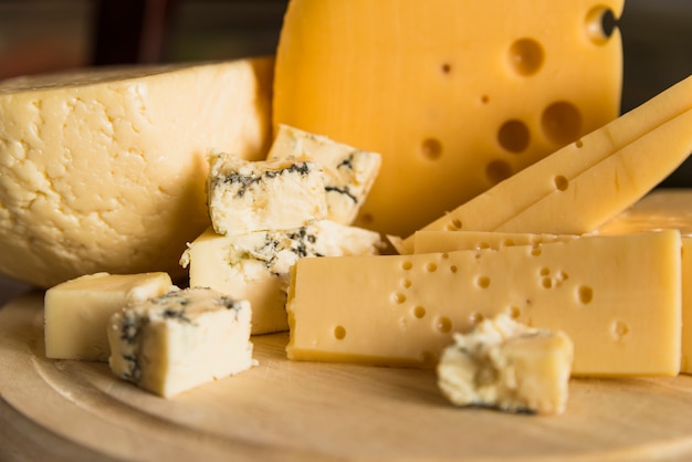 Fresh cheese on wood chopping board Free Photo