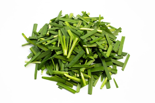 Premium Photo | Fresh chinese chive leaves on white background.