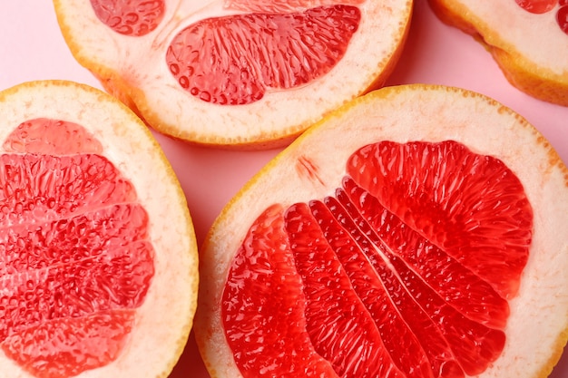 Premium Photo | Fresh cut grapefruit on color background