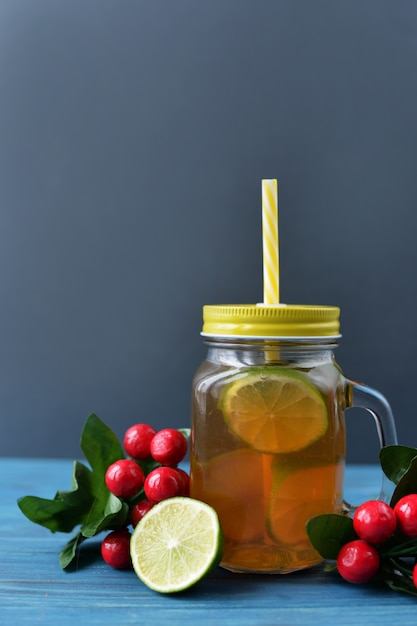 Premium Photo | Fresh drink tea with lime fruit in a glass