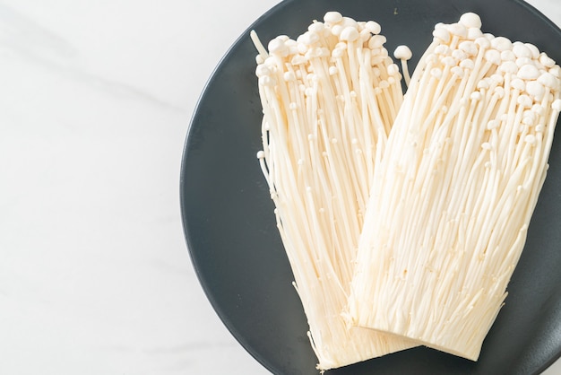 Premium Photo Fresh Enoki Mushroom Or Golden Needle Mushrooms On Plate