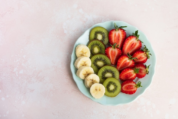 Premium Photo | Fresh fruit salad on plate